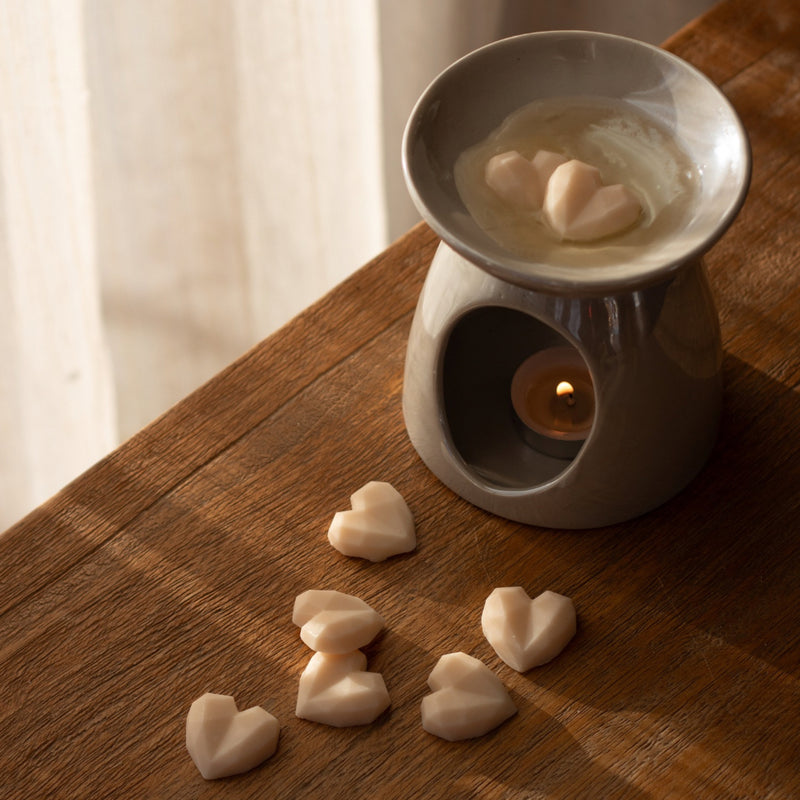 Soya Wax Melts, Scented Wax Melts, Heart Shaped from Elan Skincare on a Wax Burner and wooden table